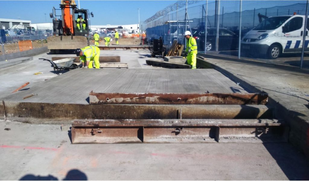 Formwork and steel edge forms set out for a concrete bay at Heathrow airside