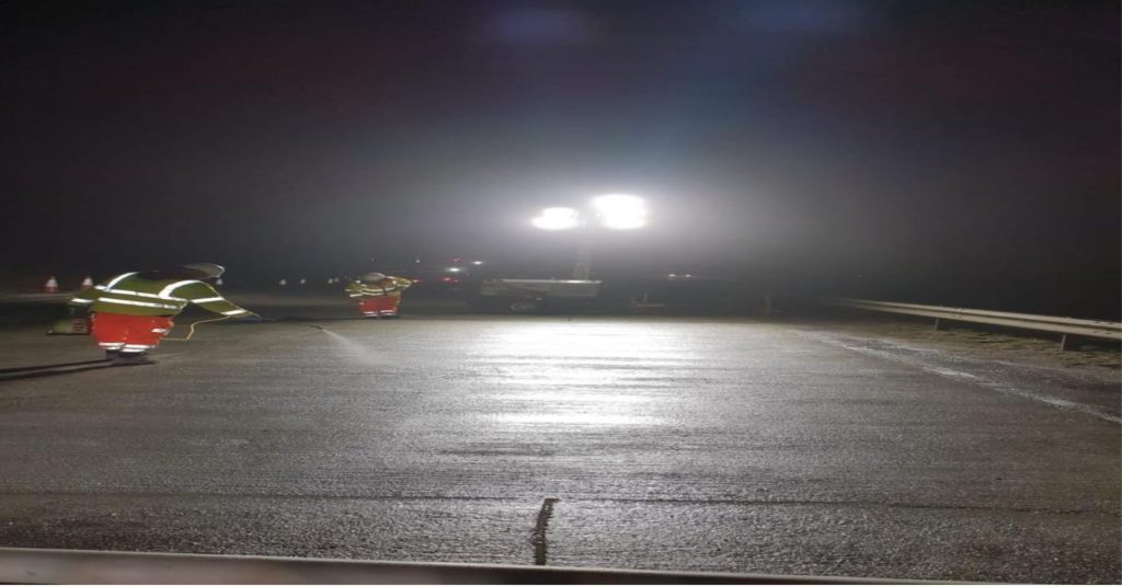 Freshly laid concrete bays lit up at night on the A11 near Wymondham