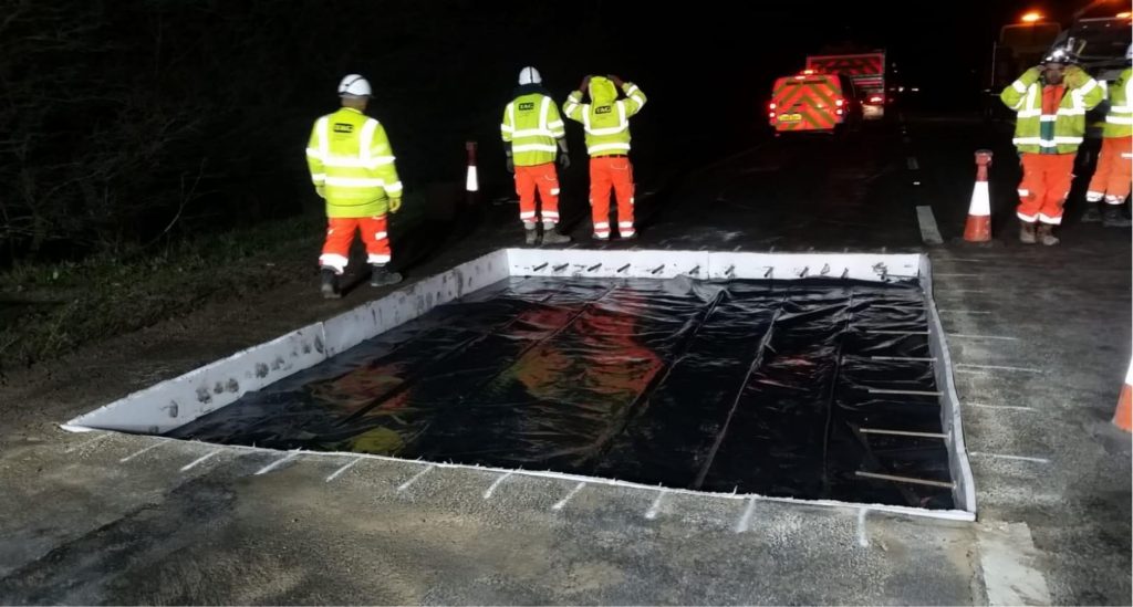Crew inspecting a membrane-lined trial bay on the A12 at Margaretting