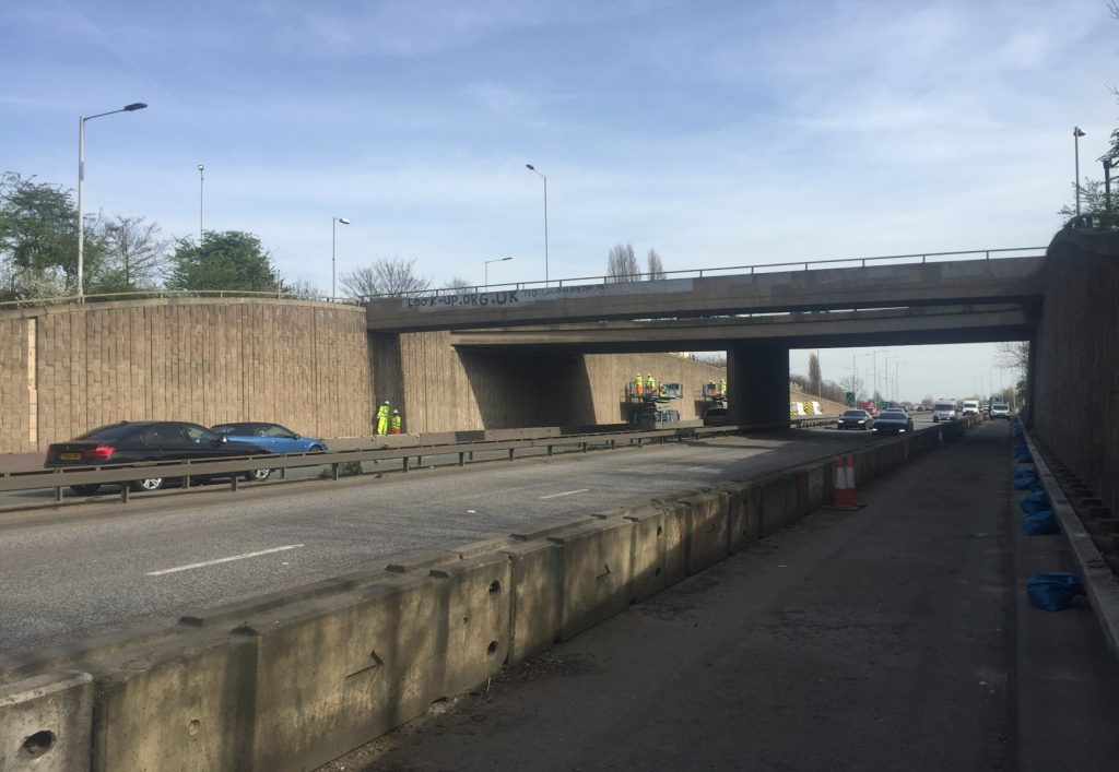 Retaining wall alongside the A40 at Northolt, with a bridge in the distance
