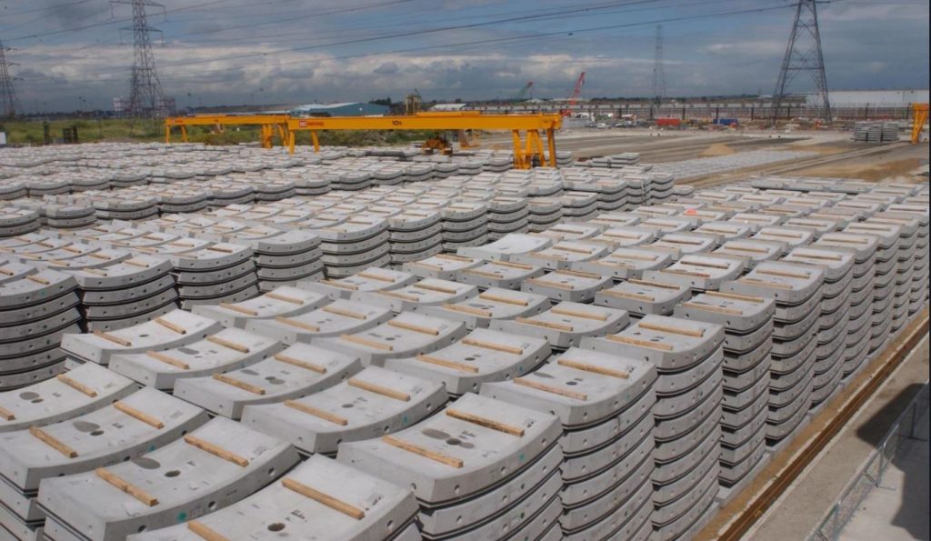 Hundreds of precast tunnel segments stored in the yard for the Channel Tunnel Rail Link