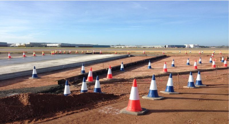 Excavated taxiway area marked out with traffic cones during reconstruction at Heathrow