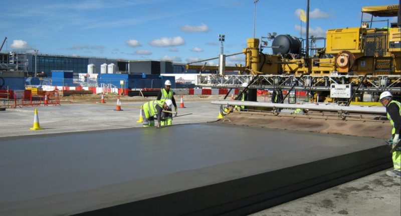 Slipform paving train laying concrete on the T2B apron at Heathrow
